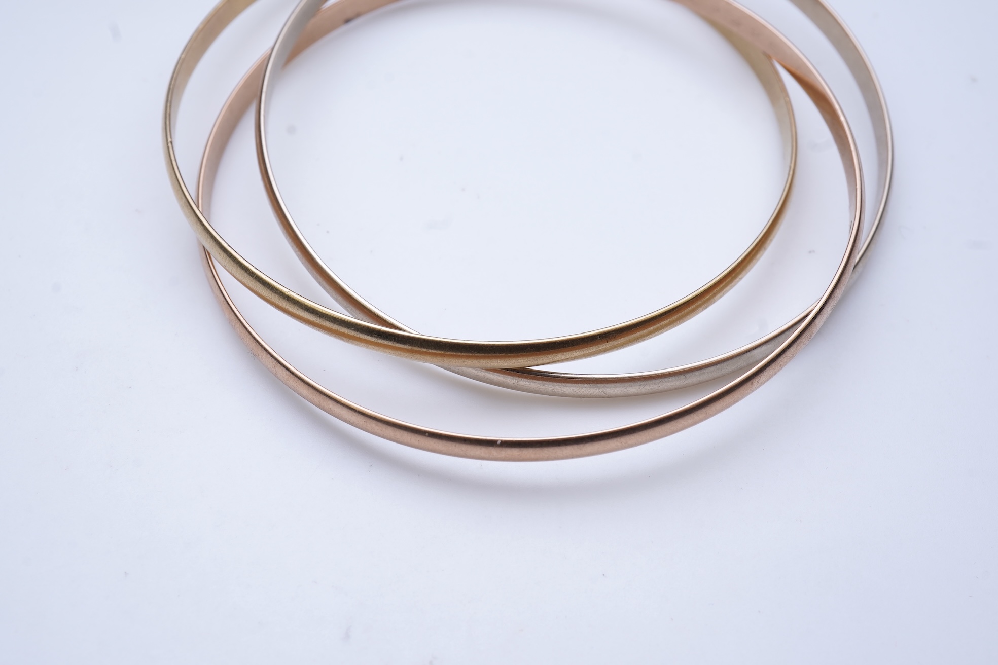 Cartier, a gold bangle, 'Trinity de Cartier'